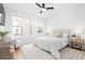 Spacious bedroom with large windows, ceiling fan, and elegant furnishings at 332 Gibson Se St, Atlanta, GA 30316