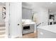A well lit Butler's Pantry located next to the staircase features storage and a microwave at 332 Gibson Se St, Atlanta, GA 30316
