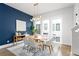 Dining room featuring modern lighting, a wood table and a large window with natural light at 332 Gibson Se St, Atlanta, GA 30316