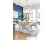 Bright dining room featuring a modern light fixture, a round table, and large windows overlooking the outside at 332 Gibson Se St, Atlanta, GA 30316