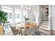 View of the dining area with a wood table and modern lighting fixtures at 332 Gibson Se St, Atlanta, GA 30316