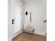 Cozy entryway with light wood bench, coat hooks, and a textured glass front door at 332 Gibson Se St, Atlanta, GA 30316