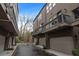 Townhome exterior with garage, private balcony, and neutral brown siding at 332 Gibson Se St, Atlanta, GA 30316