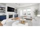 Stylish living room with built-in shelving, fireplace, and hardwood floors throughout at 332 Gibson Se St, Atlanta, GA 30316