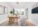 Well-lit home office with large windows, wood desk, and comfortable seating at 332 Gibson Se St, Atlanta, GA 30316