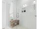 Modern glass shower featuring a wooden bench and tile niche at 332 Gibson Se St, Atlanta, GA 30316