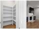 Walk in storage area with white shelving unit in an open concept home at 332 Gibson Se St, Atlanta, GA 30316