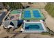 Aerial view of community amenities including pool, tennis courts, playground, and clubhouse at 4089 Palm Dr, Snellville, GA 30039