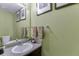 Bathroom with a framed mirror, a clean sink, and decorative touches at 4089 Palm Dr, Snellville, GA 30039