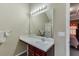 Well-lit bathroom featuring a sink, and a large mirror at 4089 Palm Dr, Snellville, GA 30039