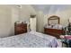 Bedroom with vaulted ceiling, a plush bed, and plenty of storage at 4089 Palm Dr, Snellville, GA 30039