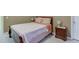 Serene bedroom featuring plush carpeting and a side table with lamp on either side of the bed at 4089 Palm Dr, Snellville, GA 30039