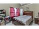 Bedroom with vaulted ceiling, a plush bed, and natural light at 4089 Palm Dr, Snellville, GA 30039