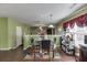 Open kitchen and dining area leading to living room; features modern appliances and wood flooring at 4089 Palm Dr, Snellville, GA 30039