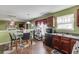 Bright kitchen with sleek appliances, stylish cabinetry, and an adjacent dining area with a kitchen table at 4089 Palm Dr, Snellville, GA 30039