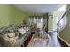 Elegant living room with hardwood floors, decorative lamps, and staircase view to the upper level at 4089 Palm Dr, Snellville, GA 30039