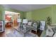 Elegant living room with hardwood floors, decorative lamps, and dining room view at 4089 Palm Dr, Snellville, GA 30039