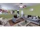 Open-concept living room with hardwood floors, connecting seamlessly to the kitchen and dining area at 4089 Palm Dr, Snellville, GA 30039