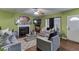 Cozy living room with fireplace, comfortable seating, hardwood floors, and stylish decor and a ceiling fan at 4089 Palm Dr, Snellville, GA 30039