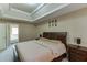 Comfortable main bedroom showcases a tray ceiling and natural light at 4089 Palm Dr, Snellville, GA 30039
