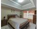 Comfortable main bedroom showcases a tray ceiling and natural light at 4089 Palm Dr, Snellville, GA 30039