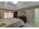 Comfortable main bedroom showcases a tray ceiling and natural light at 4089 Palm Dr, Snellville, GA 30039