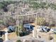 An aerial view of a single-Gathering home with a long driveway and a spacious, wooded lot with privacy at 4111 Alayna Lee Cir, Mcdonough, GA 30252