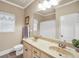 Bathroom featuring a double sink vanity, framed mirror, and tiled floors at 4111 Alayna Lee Cir, Mcdonough, GA 30252