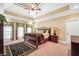 Spacious bedroom with a tray ceiling, carpeted floor and a ceiling fan at 4111 Alayna Lee Cir, Mcdonough, GA 30252