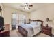 Comfortable bedroom featuring a ceiling fan, neutral walls, and a window with natural light at 4111 Alayna Lee Cir, Mcdonough, GA 30252