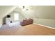 Attic bonus room featuring a sofa and entertainment center at 4111 Alayna Lee Cir, Mcdonough, GA 30252