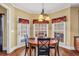 Breakfast nook with hardwood floors, natural light, and a table with seating for four at 4111 Alayna Lee Cir, Mcdonough, GA 30252