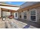 Outdoor deck featuring a grill, a cozy seating area, and a brick exterior at 4111 Alayna Lee Cir, Mcdonough, GA 30252