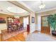 Inviting dining room features hardwood floors, elegant chandelier, wainscotting and a beautiful china cabinet at 4111 Alayna Lee Cir, Mcdonough, GA 30252