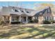 Attractive brick home with dormer windows, black shutters, and a covered front porch at 4111 Alayna Lee Cir, Mcdonough, GA 30252