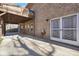 Exterior view shows a covered patio, brick siding, and concrete at 4111 Alayna Lee Cir, Mcdonough, GA 30252