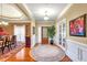 Elegant foyer featuring hardwood floors, wainscoting, and access to the dining area at 4111 Alayna Lee Cir, Mcdonough, GA 30252