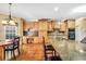 Kitchen with hardwood floors, granite countertops, stainless steel appliances, and a breakfast bar at 4111 Alayna Lee Cir, Mcdonough, GA 30252