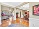 Open-concept living space with hardwood floors connecting the living and dining areas at 4111 Alayna Lee Cir, Mcdonough, GA 30252