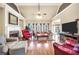Spacious living room featuring hardwood floors, a fireplace, and ample natural light at 4111 Alayna Lee Cir, Mcdonough, GA 30252