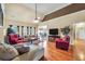 Comfortable living room featuring hardwood floors, large windows, and a cozy seating area at 4111 Alayna Lee Cir, Mcdonough, GA 30252