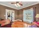 Home office with hardwood floors, a ceiling fan, and a comfortable seating area at 4111 Alayna Lee Cir, Mcdonough, GA 30252
