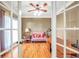 Bright office space with hardwood floors, ceiling fan, and a comfortable seating area at 4111 Alayna Lee Cir, Mcdonough, GA 30252
