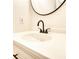 Bathroom featuring a white countertop, a white sink, and dark fixtures at 61 Andrew Rd, Covington, GA 30016