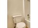 Bathroom featuring a white toilet with a white toilet seat and a shower at 61 Andrew Rd, Covington, GA 30016