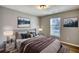 Bedroom featuring a comfortable bed, artwork, and bedside tables at 61 Andrew Rd, Covington, GA 30016