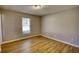 Bedroom features light-colored walls and hardwood flooring at 61 Andrew Rd, Covington, GA 30016