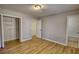 Spacious bedroom featuring hardwood floors and a closet at 61 Andrew Rd, Covington, GA 30016