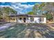 Charming single-story home with a covered carport and a well-maintained front lawn at 61 Andrew Rd, Covington, GA 30016