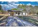 Welcoming single-story home featuring a convenient carport and a long driveway at 61 Andrew Rd, Covington, GA 30016